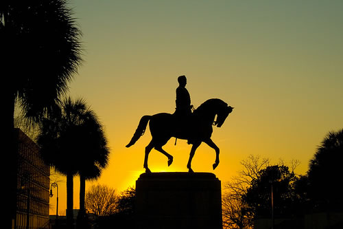 Horse and rider statue in silhouette
